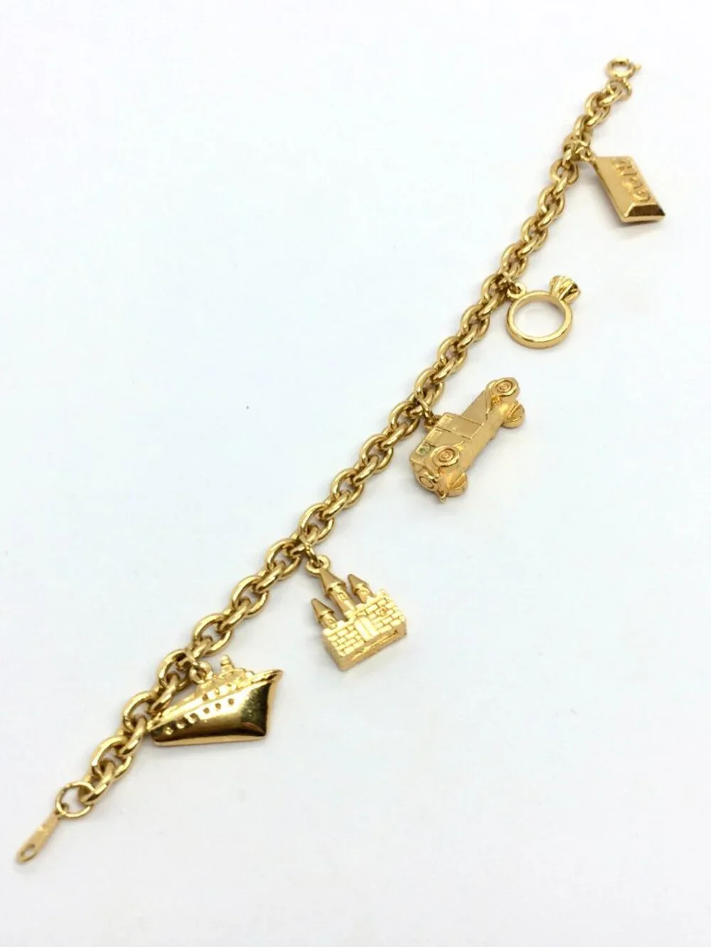 VINTAGE AVON BRACELET Rich & Famous Gold Tone 5 Charm Travel Theme 1980s - Picture 8 of 12